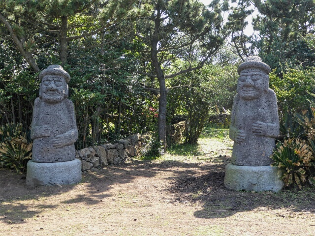 Stone "Grandfathers" placed outside of gates for protection against demons