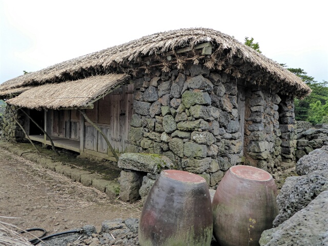 ... thatched-roof houses 
