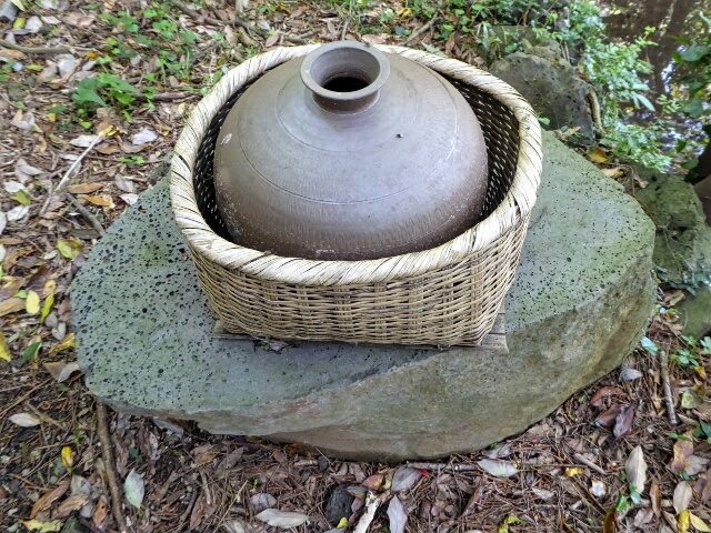 Traditional water pot and carrying basket