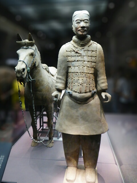 Warrior with saddled horse