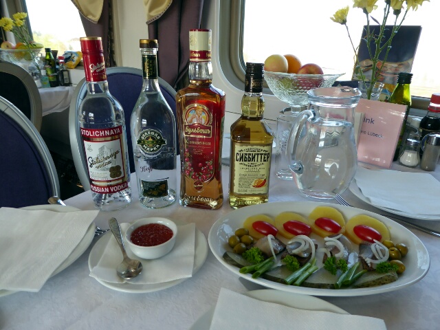 Vodka tasting on the train - 4 different vodkas, caviar and pickled herrings