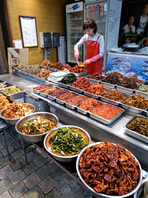 Preparing some different kimchis at the Dongmun Tradional Market